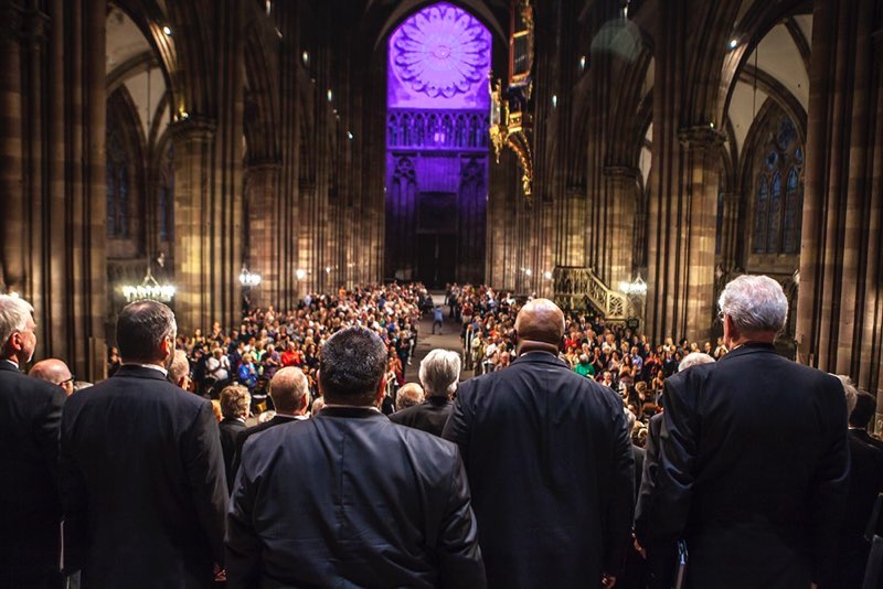 Adult choral society performing to full cathedral