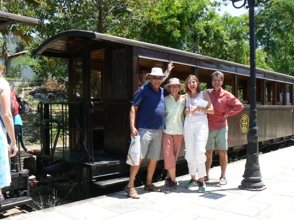 ACFEA courier Dragana with tour members on a train platform
